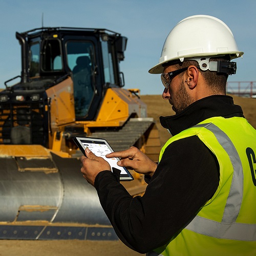 man on tablet at jobsite